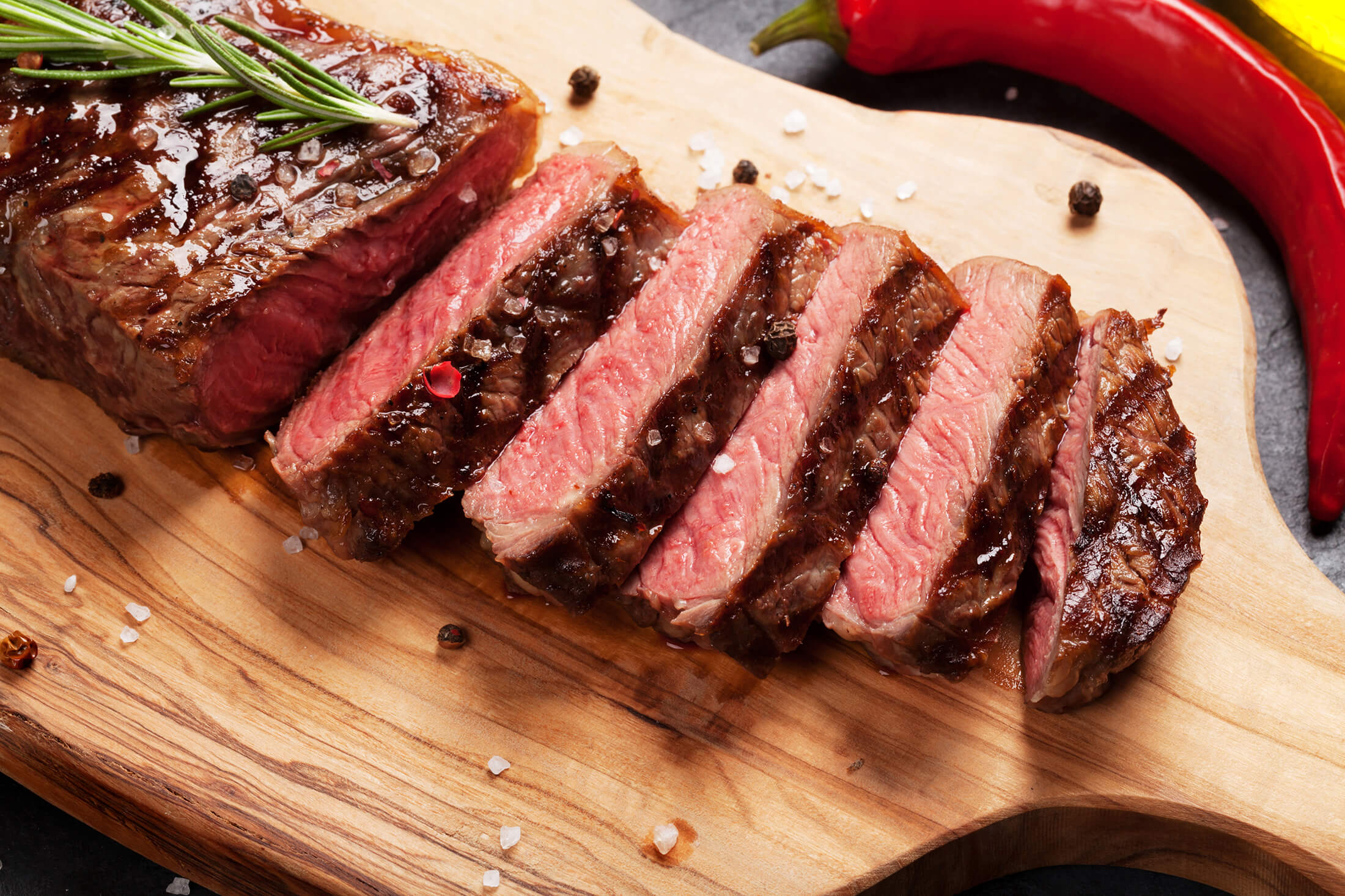 A steak on a wooden board