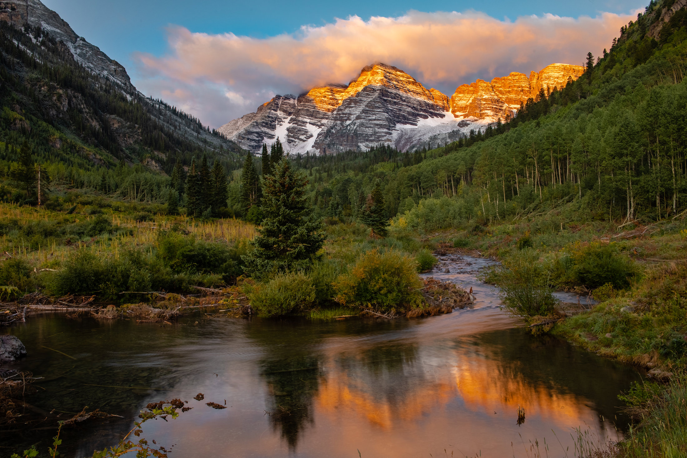 View of lake and mountains at sunset