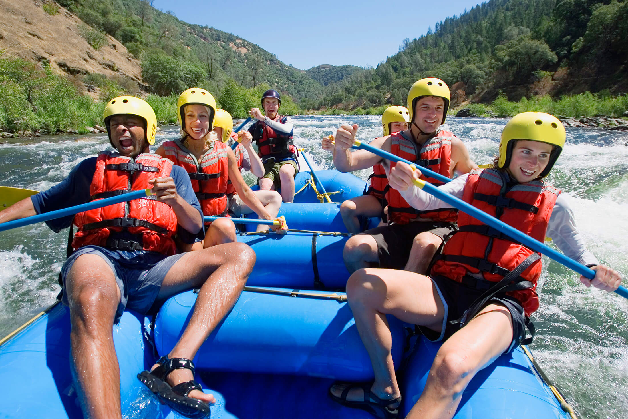 People in white water raft